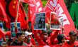 A number of workers, communities, and journalists take action to commemorate Labor Day in...