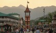 Indian tourists and local people walk near the Clock Tower (Ghanta Ghar) in Srinagar, Jamm...
