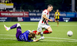 Vitesse goalkeeper Mikki van Sas and Top Oss forward Giovanni Korte play during the match...