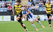Issac Fletcher, from Barrow, controls the ball during the Sky Bet League 2 match between C...
