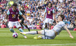 Marcus Edwards #22 of Burnley FC is tackled by Jake Cooper #5 of Millwall F.C. during the...