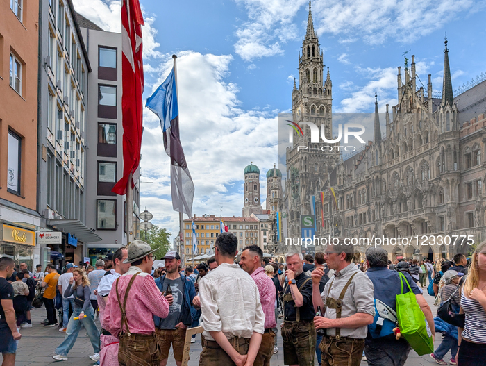 Tourists And Locals At Marienplatz In Front Of Munich’s New Town Hall