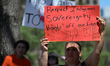 EDMONTON, CANADA - MAY 3:First Nations counter-protesters and allies hold a Canadian flag...