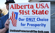 EDMONTON, CANADA - MAY 3:A participant holds a placard reading 'Alberta USA 51st State. O...