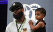 Odell Beckham Jr. walks through the paddock at the Miami International Autodrome in Miami,...