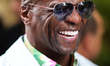 Terry Crews speaks to fans in the paddock at the Miami International Autodrome in Miami, F...