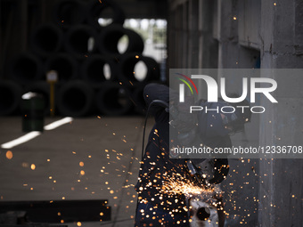 An Iranian worker works at the Kerman steel and rolling complex in Khazra industrial city in Kerman province, 971 km (603 miles) southeast o... by Morteza Nikoubazl/NurPhoto