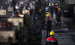 Iranian workers work at the Kerman steel and rolling complex in Khazra industrial city in...