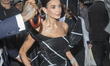 Demi Moore wears Thom Browne and departs The Pierre Hotel for the 2025 Met Gala in New Yor...