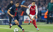 Achraf Hakimi of Paris Saint-Germain and Gabriel Martinelli of Arsenal participate in the...