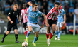 Ben Sheaf (14 Coventry City) challenges Jobe (7 Sunderland) during the Sky Bet Championshi...
