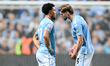 Jack Rudoni (5 Coventry City) speaks with Milan Van Ewijk (27 Coventry City) after his mis...