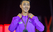 Gold medalist Sanghyeok Woo of South Korea poses on the podium during the medal ceremony o...