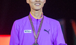 Gold medalist Sanghyeok Woo of South Korea poses on the podium during the medal ceremony o...