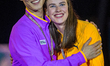 Gold medalists Sanghyeok Woo of South Korea and Yaroslava Mahuchiki of Ukraine celebrate o...