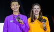 Gold medalists Sanghyeok Woo of South Korea and Yaroslava Mahuchiki of Ukraine celebrate o...