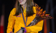 Yaroslava Mahuchiki of Ukraine celebrates with the trophy on the podium during the medal c...