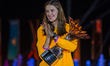 Yaroslava Mahuchiki of Ukraine celebrates with the trophy on the podium during the medal c...