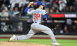Chicago Cubs pitcher Tom Cosgrove #38 throws during the eighth inning of a baseball game a...