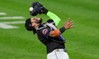 New York Mets catcher Francisco Alvarez #4 cannot make the catch during the eighth inning...