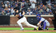 New York Mets player Pete Alonso #20 doubles during the fourth inning of a baseball game a...