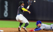 Chicago Cubs player Pete Crow-Armstrong #4 is thrown out trying to steal second base as Me...