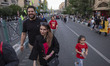 An Iranian family walks along a bridge while participating in a religious festival celebra...