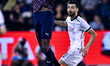 Boualem Khoukhi of Al Sadd SC and Michael Olunga of Al Duhail FC are in action during the...