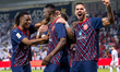 Michael Olunga (C) of Al Duhail FC celebrates with teammates after scoring during the Qata...