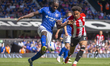Axel Tuanzebe of Ipswich Town and Kevin Schade of Brentford battle for the ball during the...