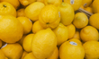 EDMONTON, CANADA - MAY 7: A presentation of fresh yellow lemons in a grocery store, photo...