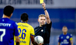 Referee Alex Bos issues a yellow card to SC Cambuur Leeuwarden midfielder Tyrique Mercera...