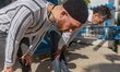 Fergie Chambers performs a Muslim prayer with his friend at home in Tunis, Tunisia, on Feb...