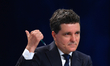 Pro-European independent presidential candidate and Bucharest Mayor Nicusor Dan gestures d...