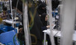 Female Iranian laborers work on the electrical parts production line at a factory that mak...