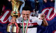 Dan Ndoye of Bologna FC poses with the trophy at the end of the Coppa Italia Frecciarossa...
