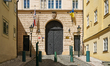 The main entrance of the British Embassy displays Czech and Ukrainian flags on a quiet cob...
