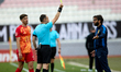 Match referee Slobodan Petrovic shows a yellow card to Stefano De Angelis, head coach of B...