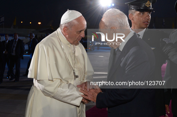 Pope Francis shakes hands with Israeli President Shimon Peres as he departs at Ben Gurion International Airport in Tel Aviv, Israel on May 2...
