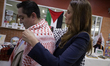 Nadya Rasheed (right), Palestinian Ambassador to Mexico, meets with attendees at the Natio...