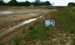 The concessionaire of the A69 places a sign reading 'Beware invasive plants' at an A69 con...
