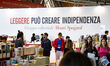 People visit the stand of the editorial group of Mauri Spagnol Garzanti with a slogan read...