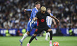 Lamine Yamal of FC Barcelona controls the ball while Javi Puado of RCD Espanyol defends du...
