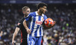 Omar El Hilali of RCD Espanyol controls the ball while Dani Olmo of FC Barcelona defends d...