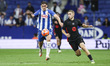 Fermin Lopez of FC Barcelona controls the ball while being defended by Marash Kumbulla of...