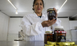 Martha Flores Garcia, a beekeeper, displays products made with honey from bees grown betwe...