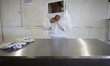 Martha Flores Garcia, a beekeeper, works with bees and breeding chambers between the borde...