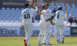 Codi Yusuf of Durham celebrates with his teammates after claiming the wicket of Nottingham...