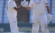 Haseeb Hameed of Nottinghamshire celebrates with Brett Hutton after reaching 150 during th...