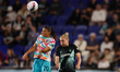 San Diego Wave FC midfielder Delphine Cascarino #20 leaps higher than Gotham FC midfielder...